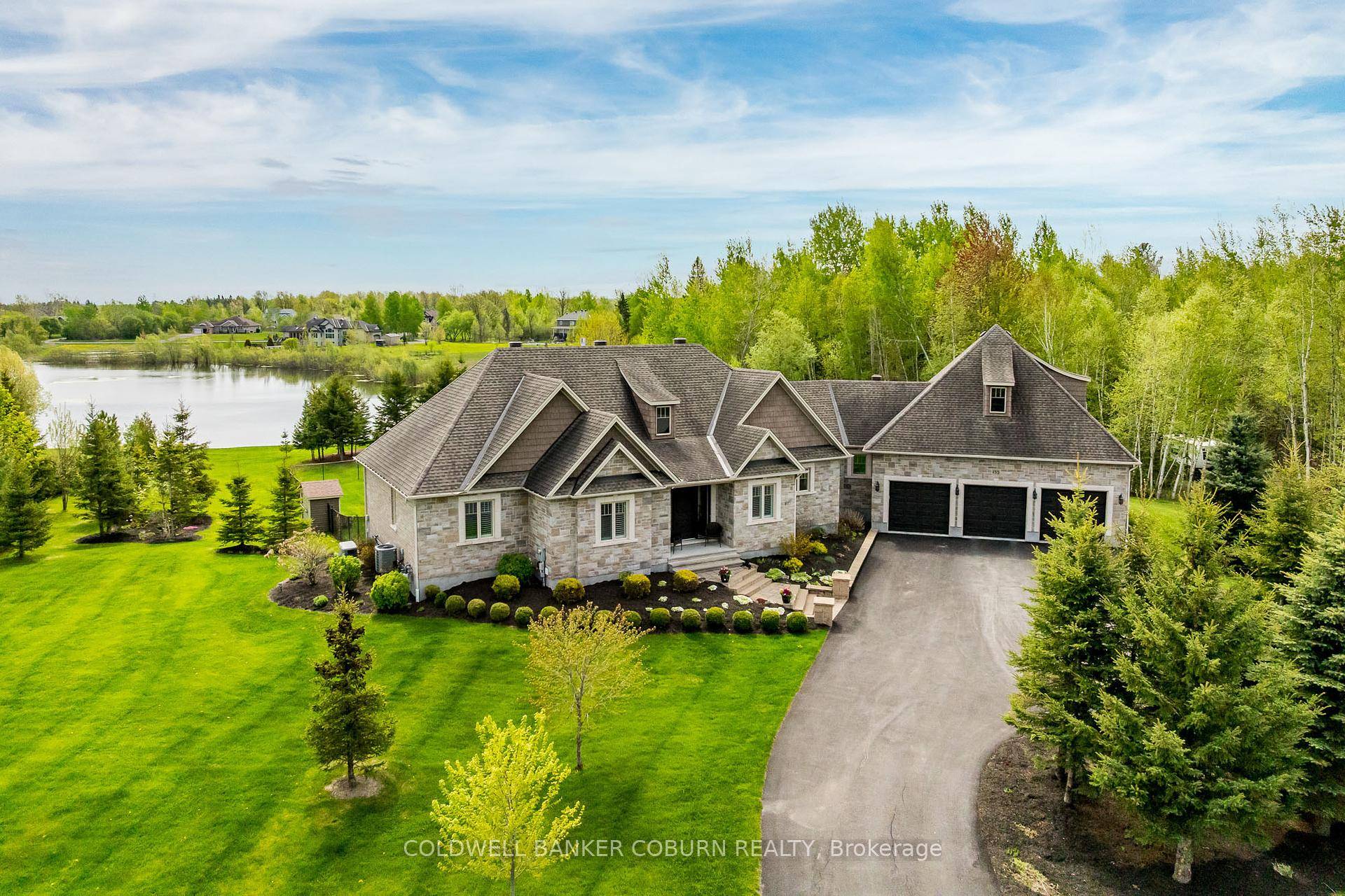Welcome to this masterfully crafted bungalow set on a sought after waterfront corner lot in the exclusive West Lake Estates.