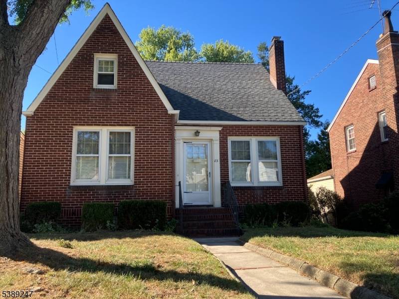 All Brick mint condition Cape offering hardwood floors natural wood trim, enclosed rear porch overlooking private backyard, 1 1 2 baths, finished basement with summer Kit.