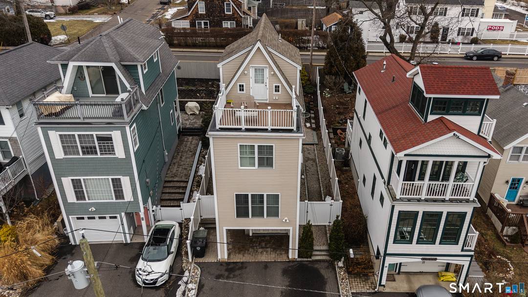 Experience coastal living at its finest in this beautifully updated three story home just steps from the ocean.