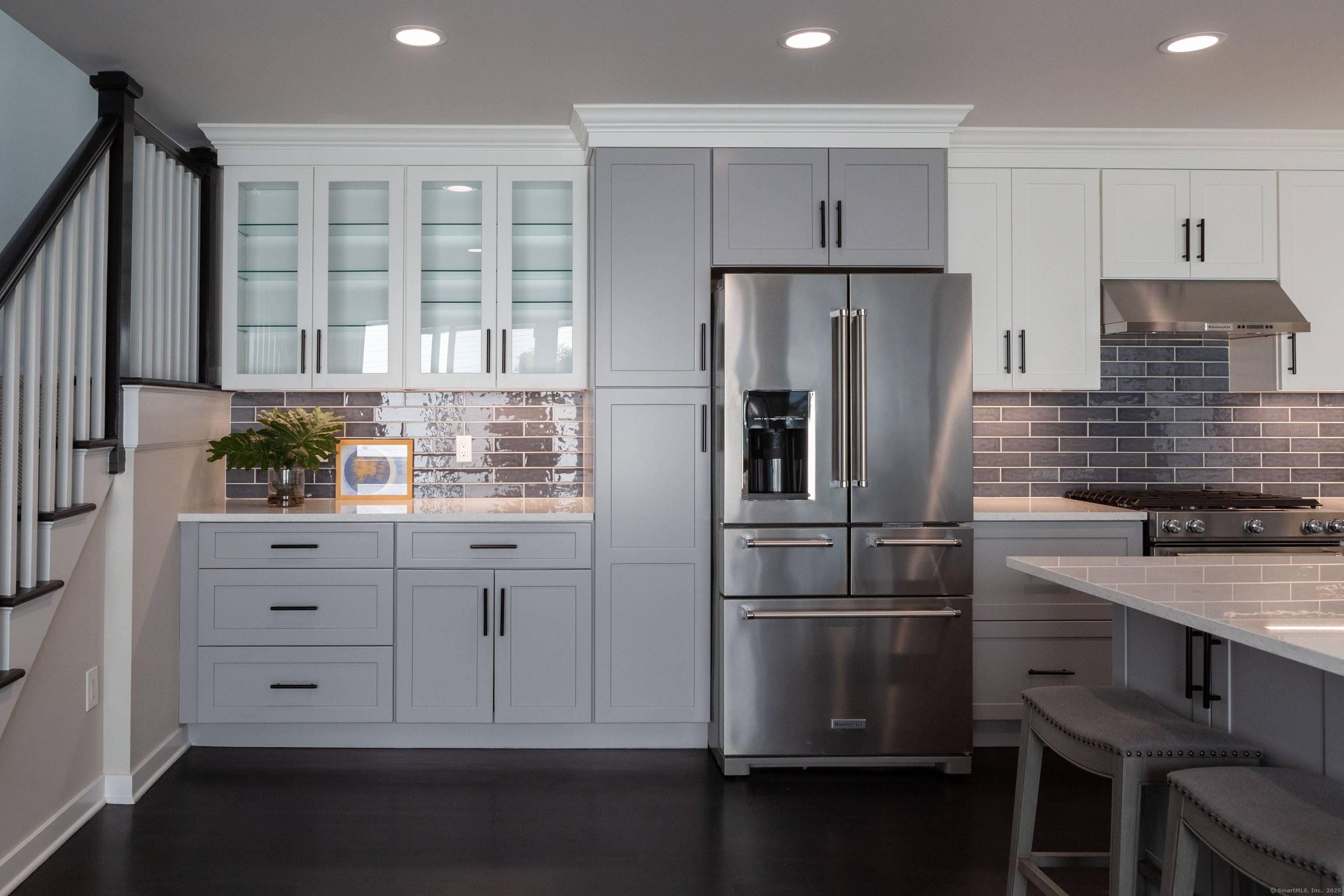 This beautifully renovated townhouse combines effortless one level living with dual primary suites on both the first and second floors.