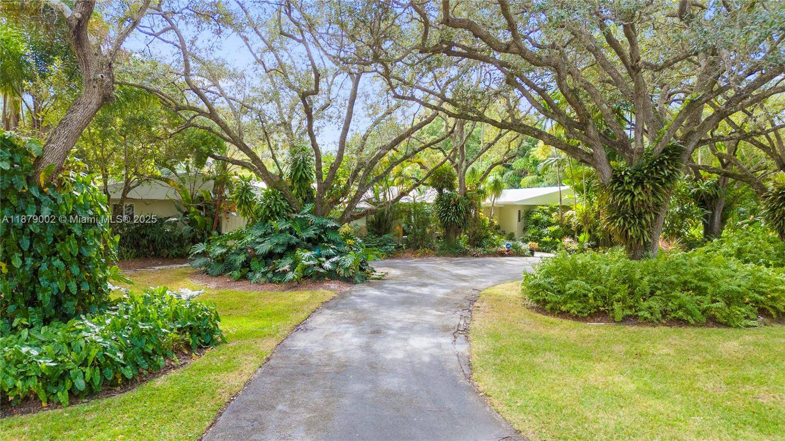 Discover serenity in this enchanting Pinecrest oasis nestled on a lush 36, 677 SF lot.