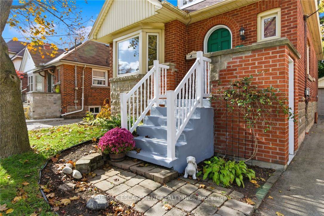 Welcome to 76 East 15th Street a storybook red brick home in Hamilton Mountain's sought after Inch Park neighbourhood, celebrated for its tree lined streets and family friendly charm.