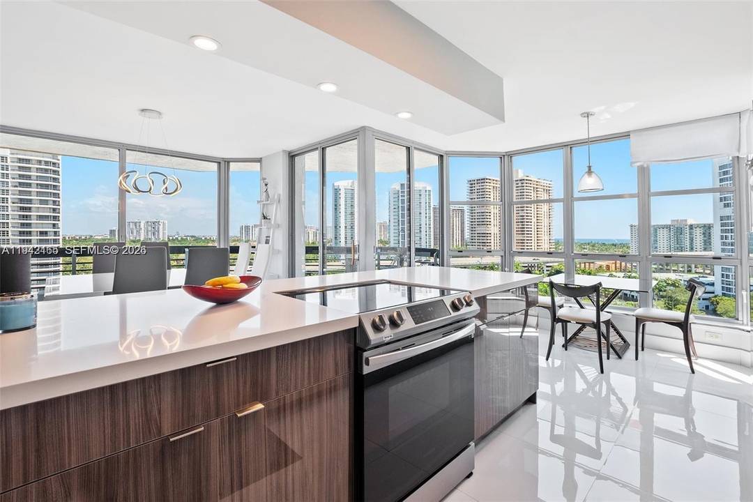 Beautifully remodeled, excellent corner unit in prestigious Mystic Pointe Towers.