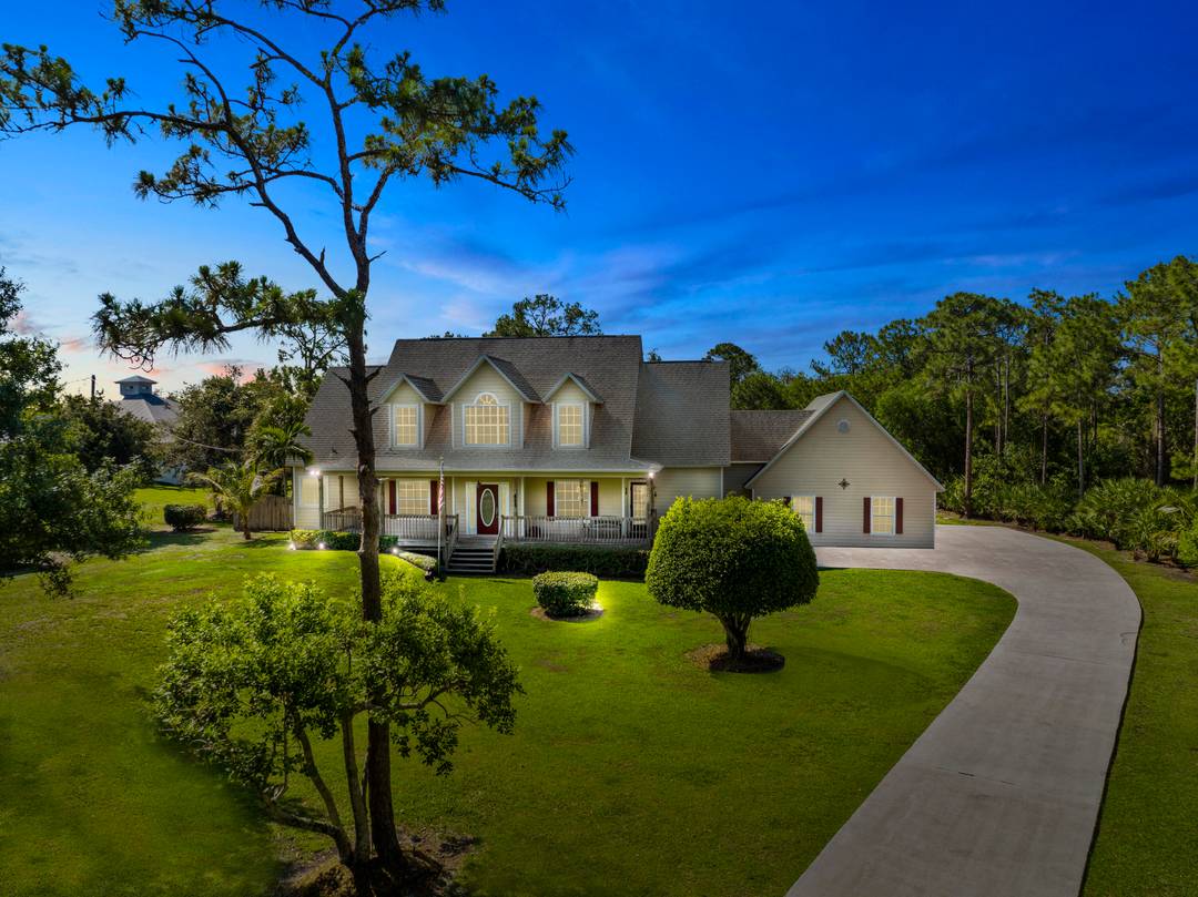 Set on 2 acres of privacy, this custom 4 bedroom, 3.
