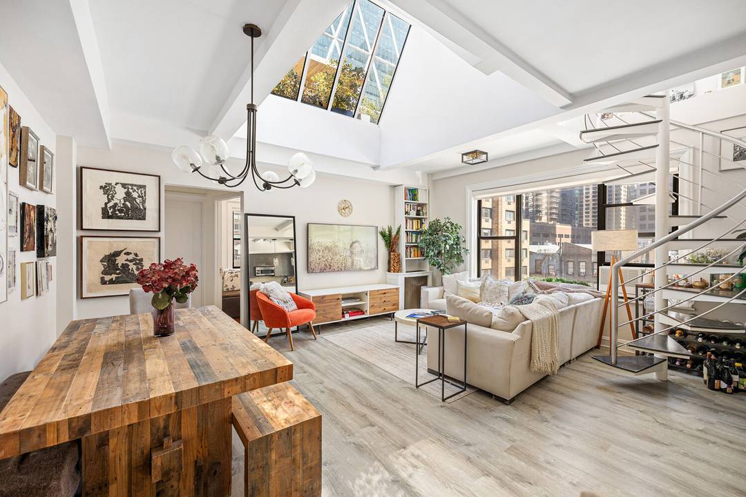 Welcome to Apartment 93 at 321 West 55th Street, a unique penthouse residence offering a rare combination of space, light, and outdoor living in the heart of Midtown Manhattan.