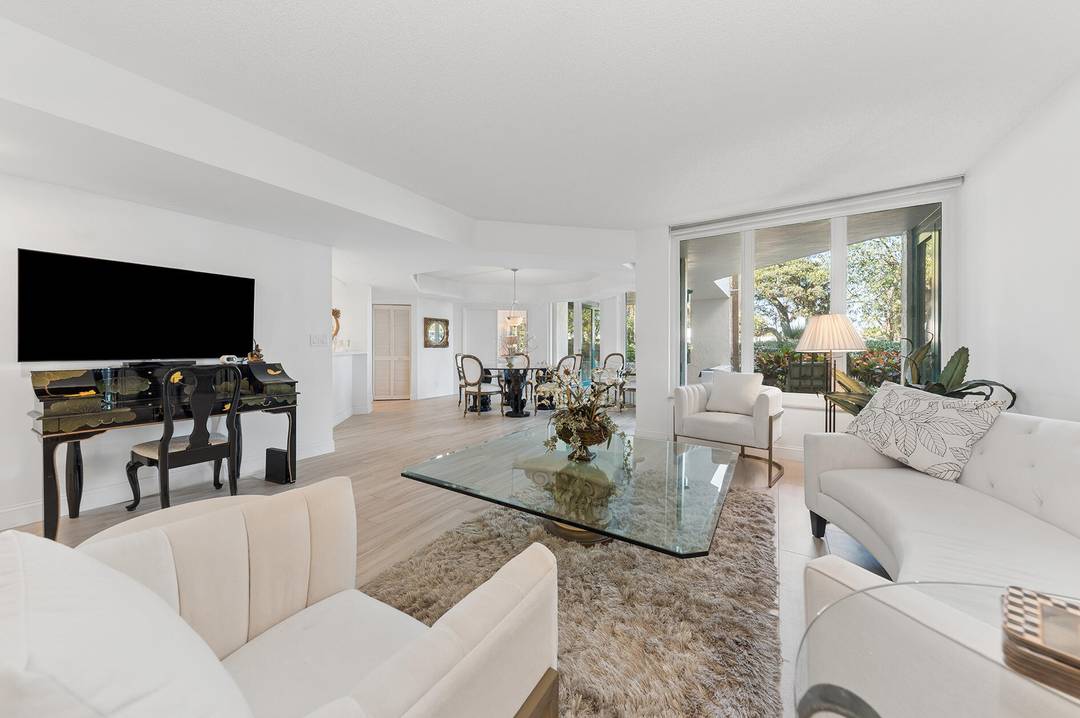 Amazing ''villa'' style 1st floor condo with direct access to a beautiful garden, pools, party rooms, billiard library room, and Intracoastal waterway just steps away.