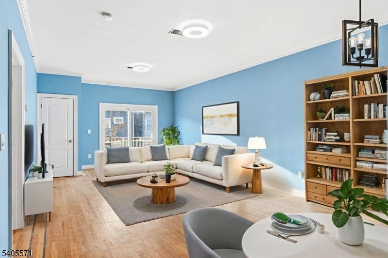 Open concept Ironbound condo featuring hardwood floors, a primary suite with private bath, and rare two car garage parking.