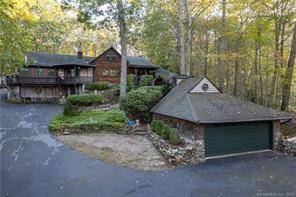 Spacious Custom Built Log Home is sited on private lot.