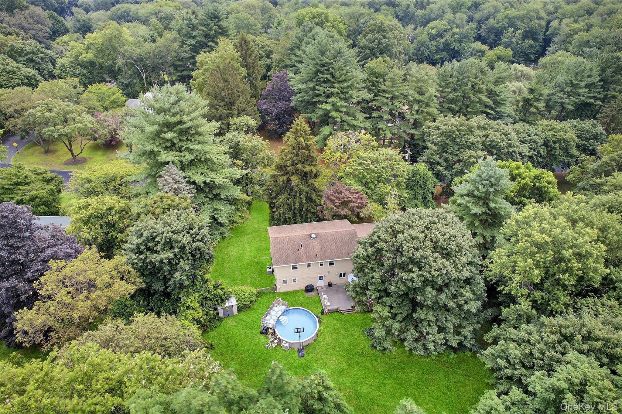 Sitting high on a gentle knoll in the heart of beautiful Montebello, NY, this impeccably maintained and thoughtfully updated colonial offers the perfect blend of timeless charm and modern comfort.
