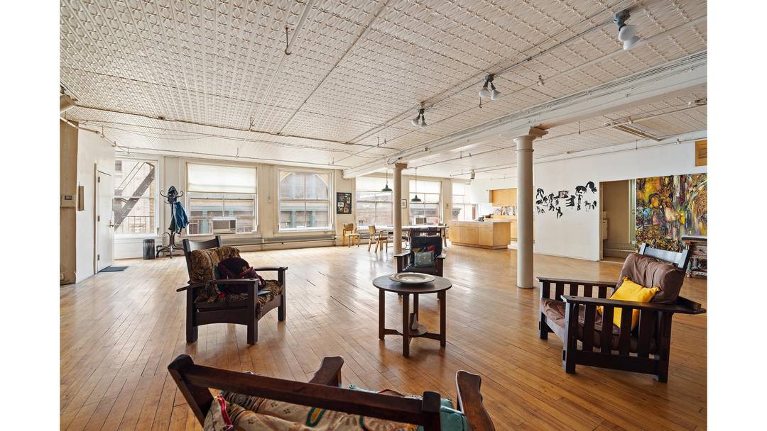 Perched on the fifth floor of a historic cast iron loft building on Wooster Street between Spring and Broome, this extraordinary 5, 200 square foot artist's loft is a rare ...