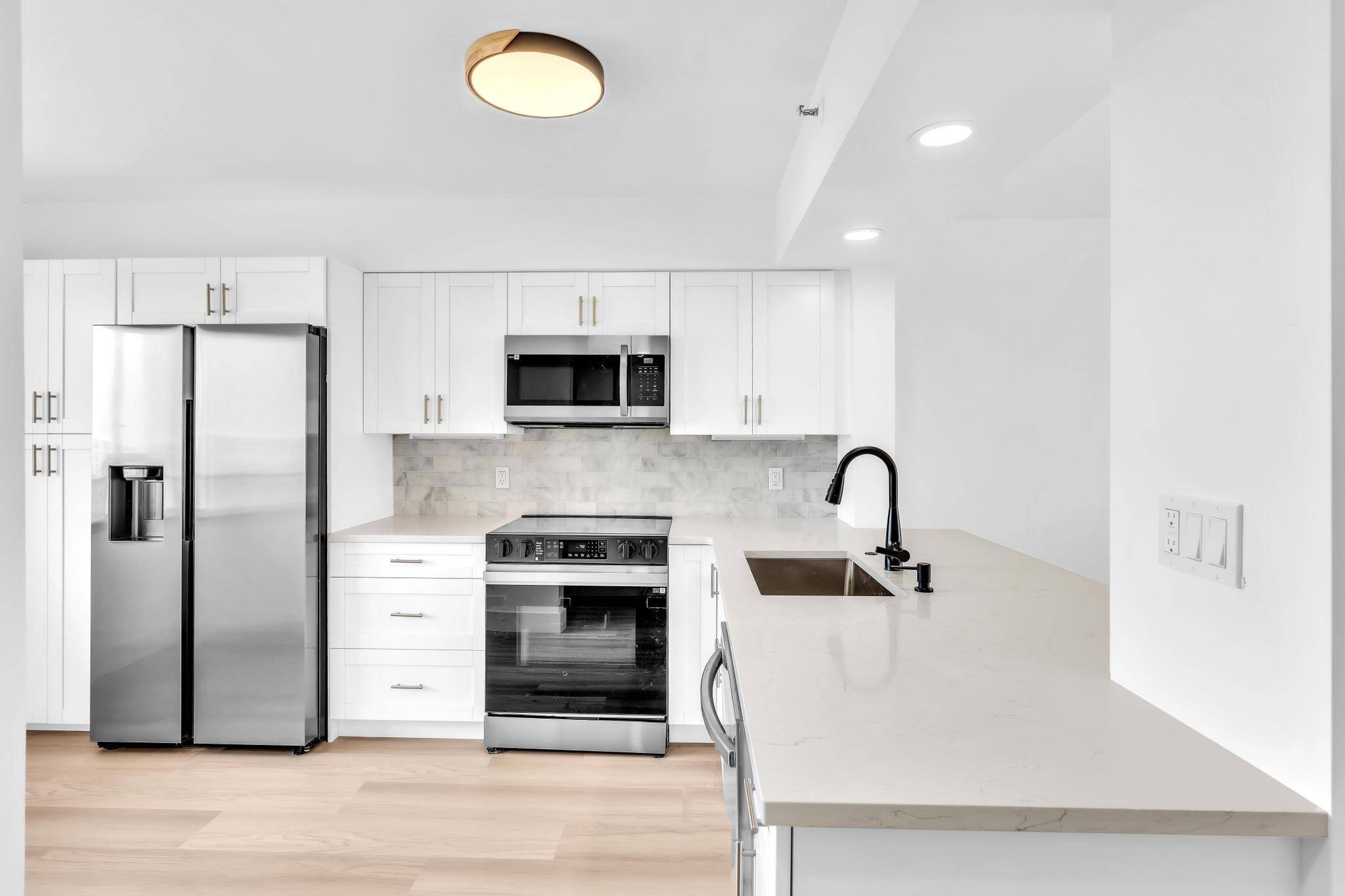 COMPLETELY remodeled 2 bed, 2 bath, 2nd floor END UNIT with serene, park like views from every window, overlooking a beautiful lake.