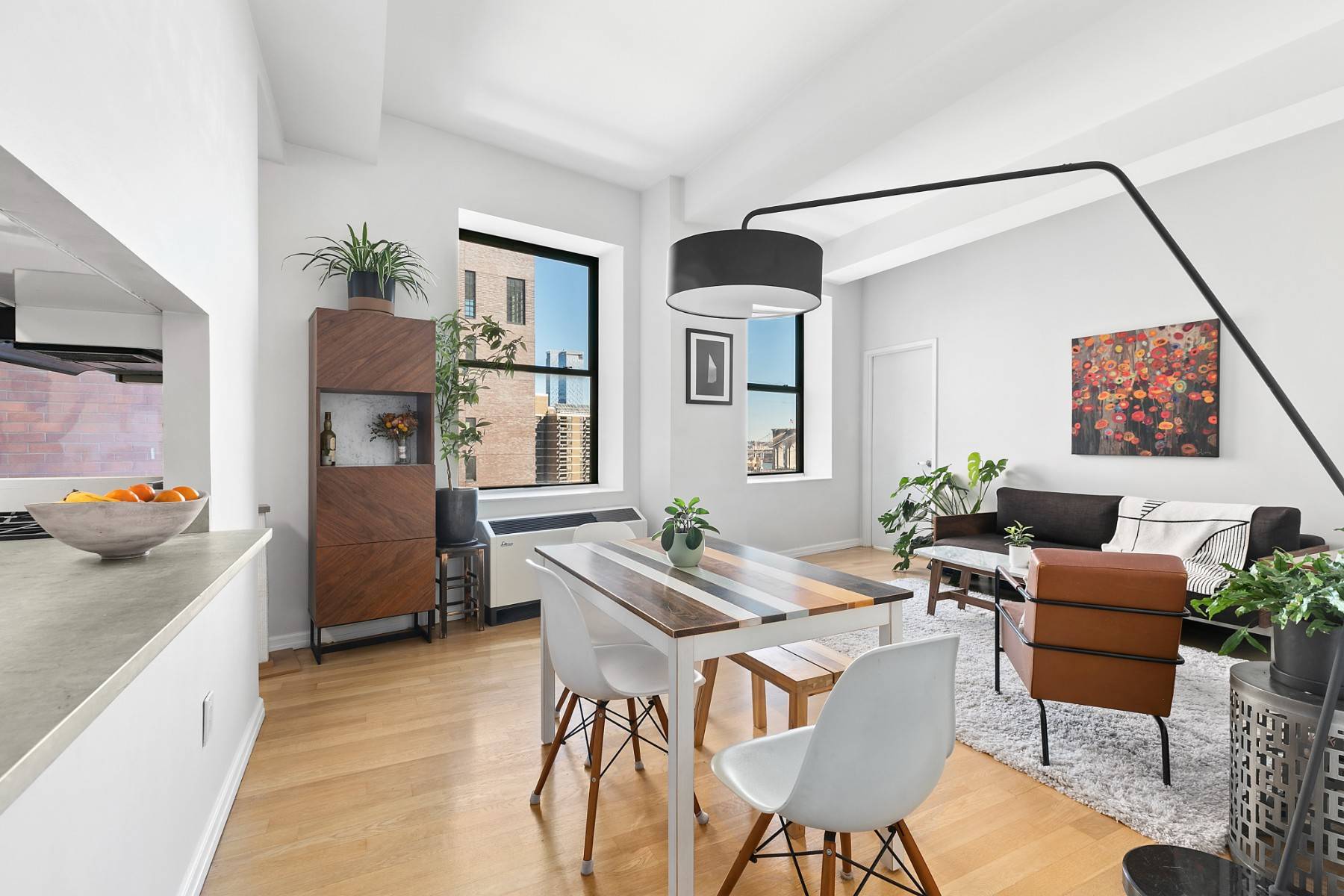 Stunning corner two bedroom, one bath with soaring 11 foot lofted ceilings and sunny North East facing exposure including views of the Brooklyn Bridge and the East River making this ...