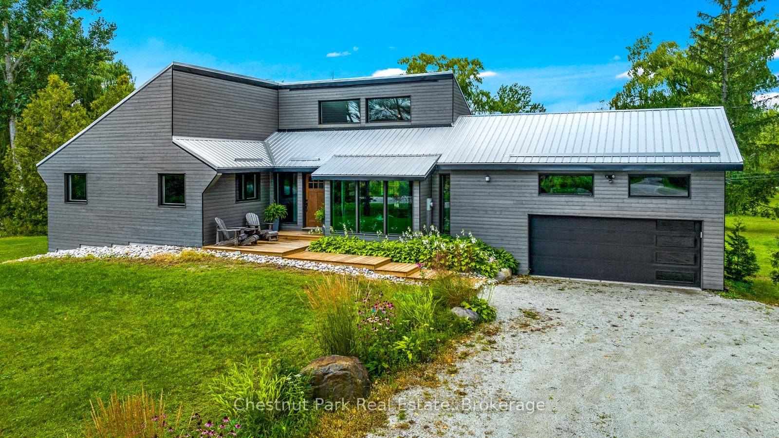 Escarpment view from your 3 bedroom 3 1 2 bathroom home set on 3 acres with attached amp ; detached garages, and pond.