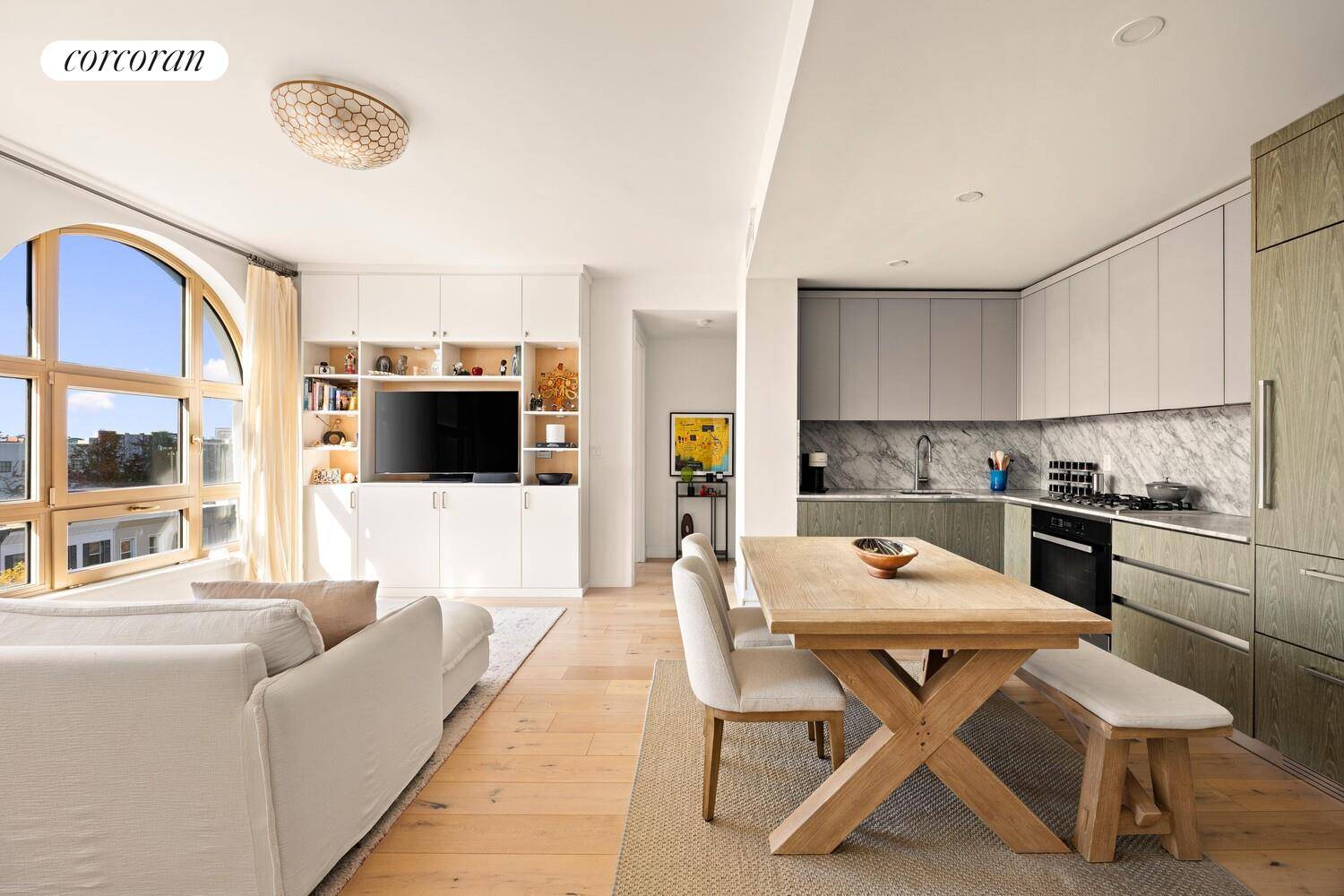 Come home to this super stylish, sunny and like new 2 bed, 1 bath condo WITH INDOOR PARKING in the most desirable spot in Park Slope !