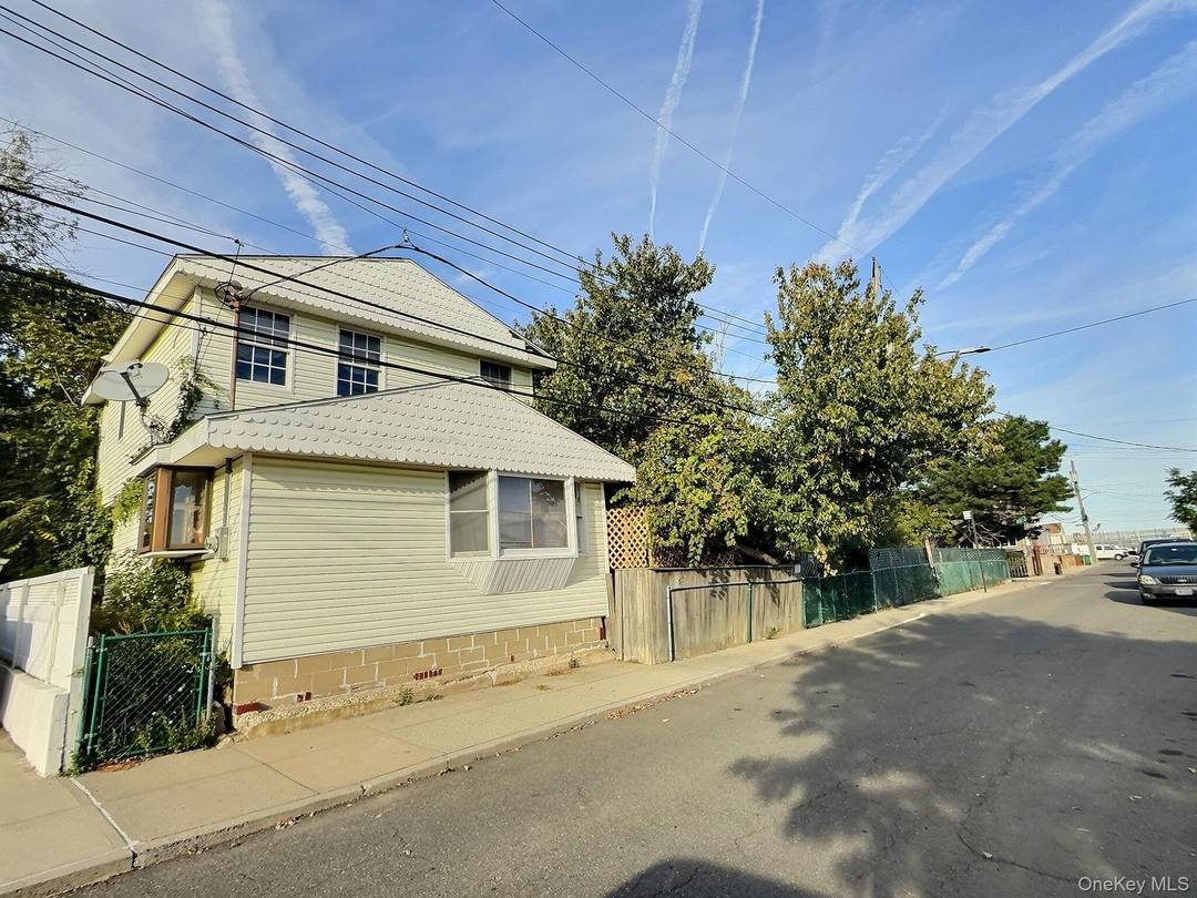Exceptional value and tremendous upside on this corner, large, versatile property featuring two separate homes.