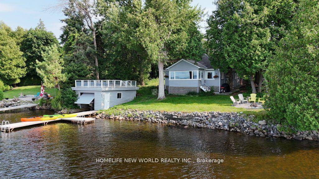 A rare opportunity to enjoy over 100 feet of pristine, clear, weed free waterfront on the beautiful Cameron Lake !