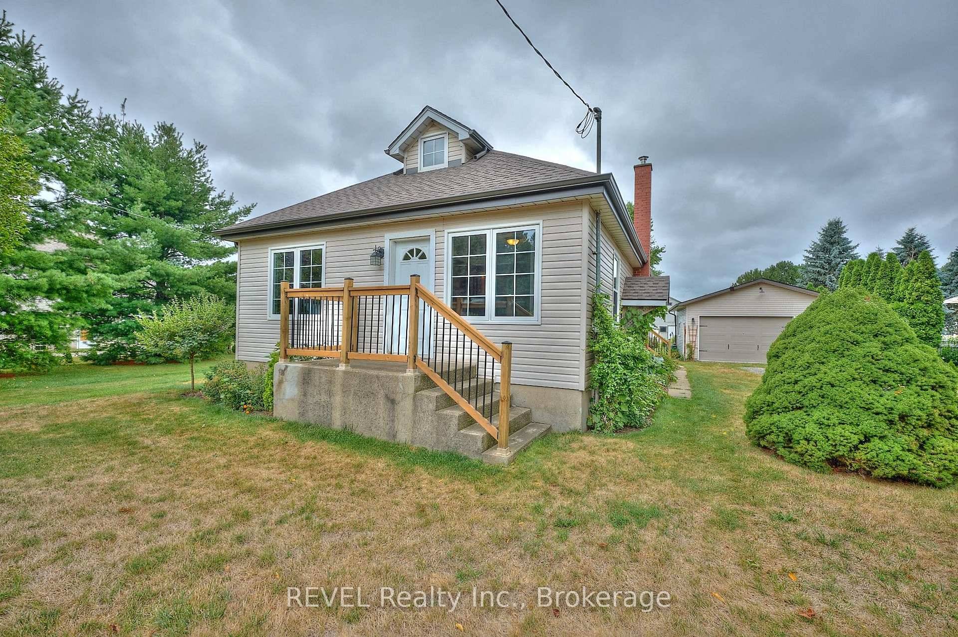 If you've been searching for rural living just outside of the city, 1317 Third Street Louth is bound to steal your heart !