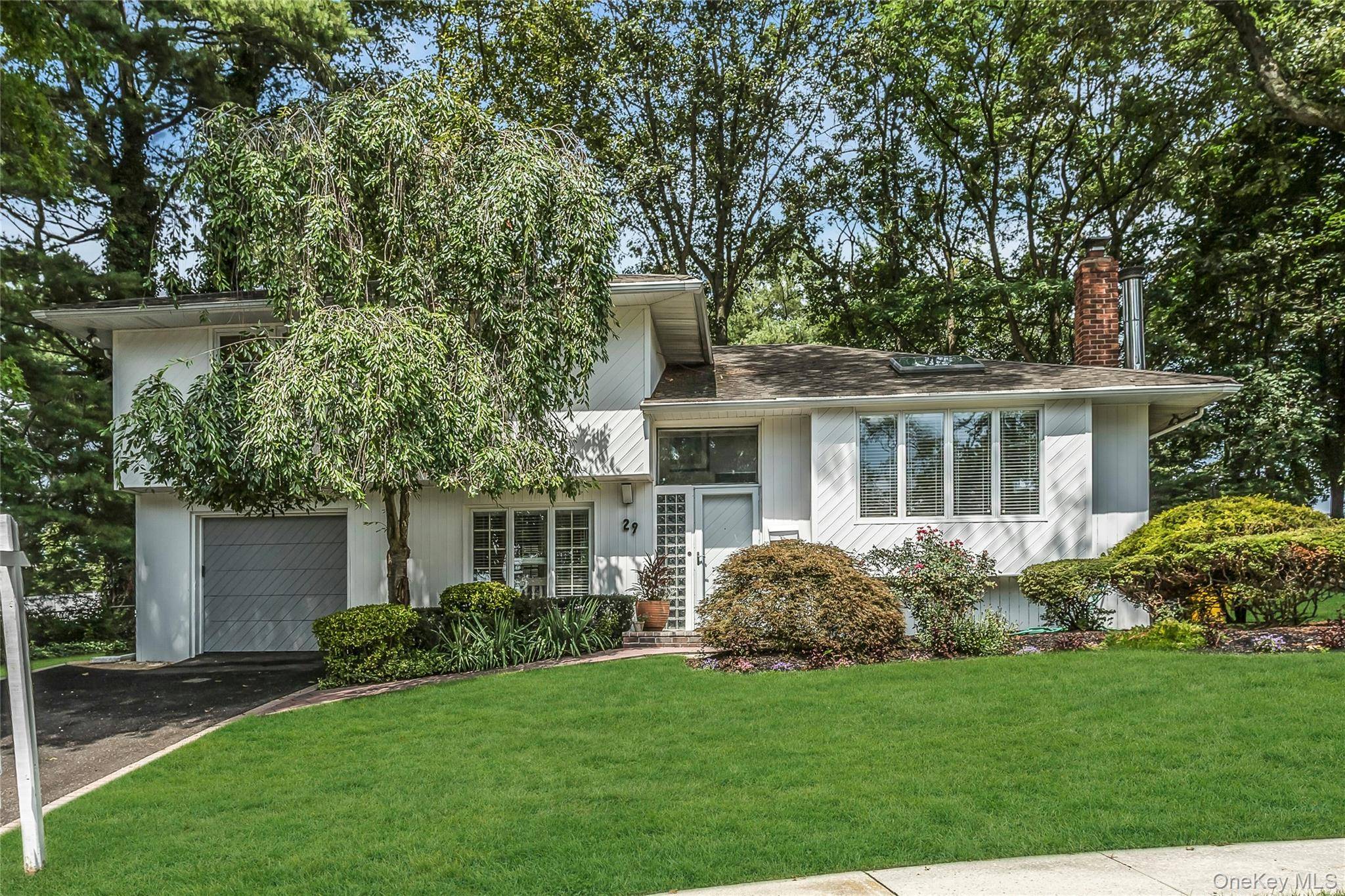 Welcome to this magnificent Expanded Split Style Home, perfectly situated in a serene cul de sac on over 1 3 acre of professionally landscaped paradise in the sought after Manetto ...