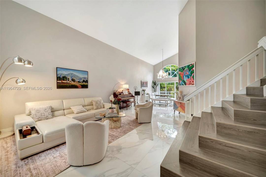 Experience resort style living in the prestigious Doral Isles Antilles !