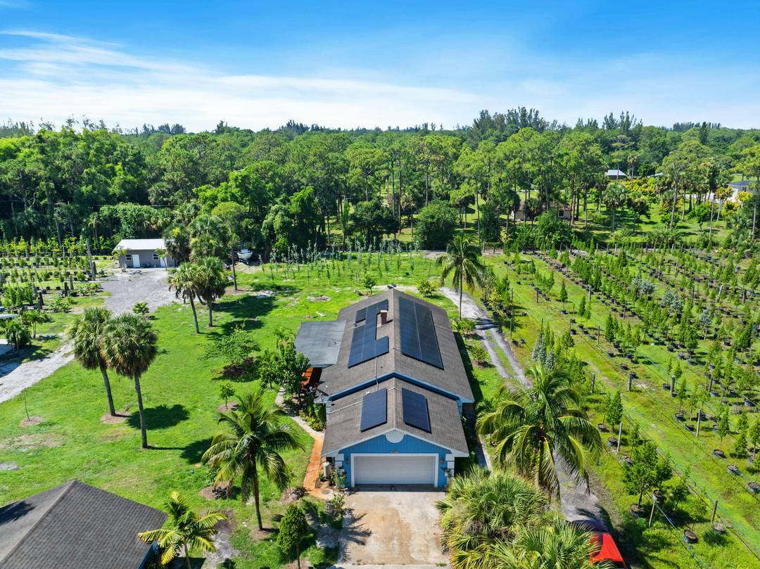 Discover nearly 6 acres of endless possibilities in the highly sought after Loxahatchee Groves neighborhood where large parcels with paved road access and private gated entry are a rare find.