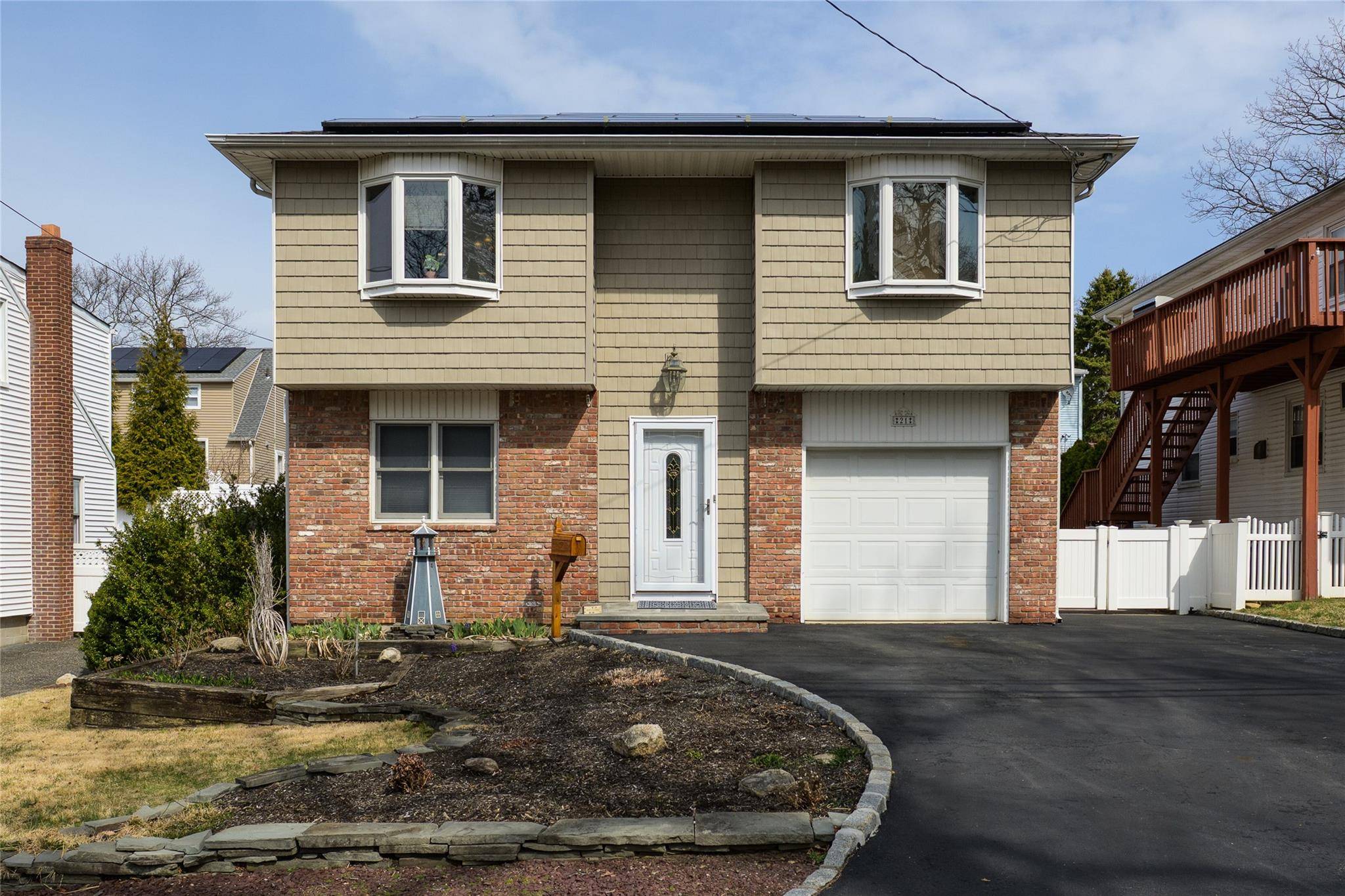 Welcome To This Bright And Inviting 5 Bedroom Home Situated In The Heart Of Bayville !