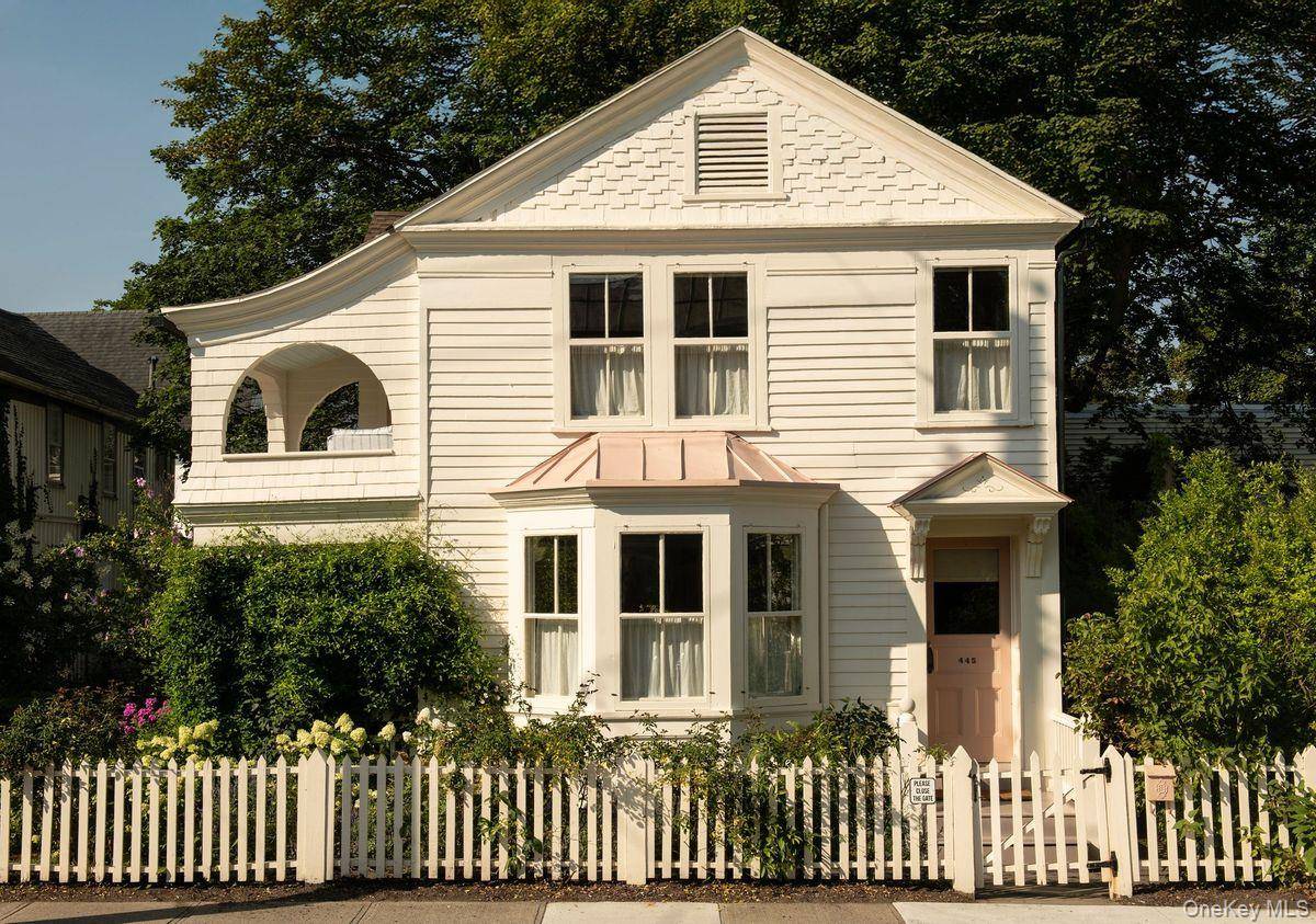 A wonderfully charming c1870 Queen Anne cottage with a detached guest house in the heart of Hudson.
