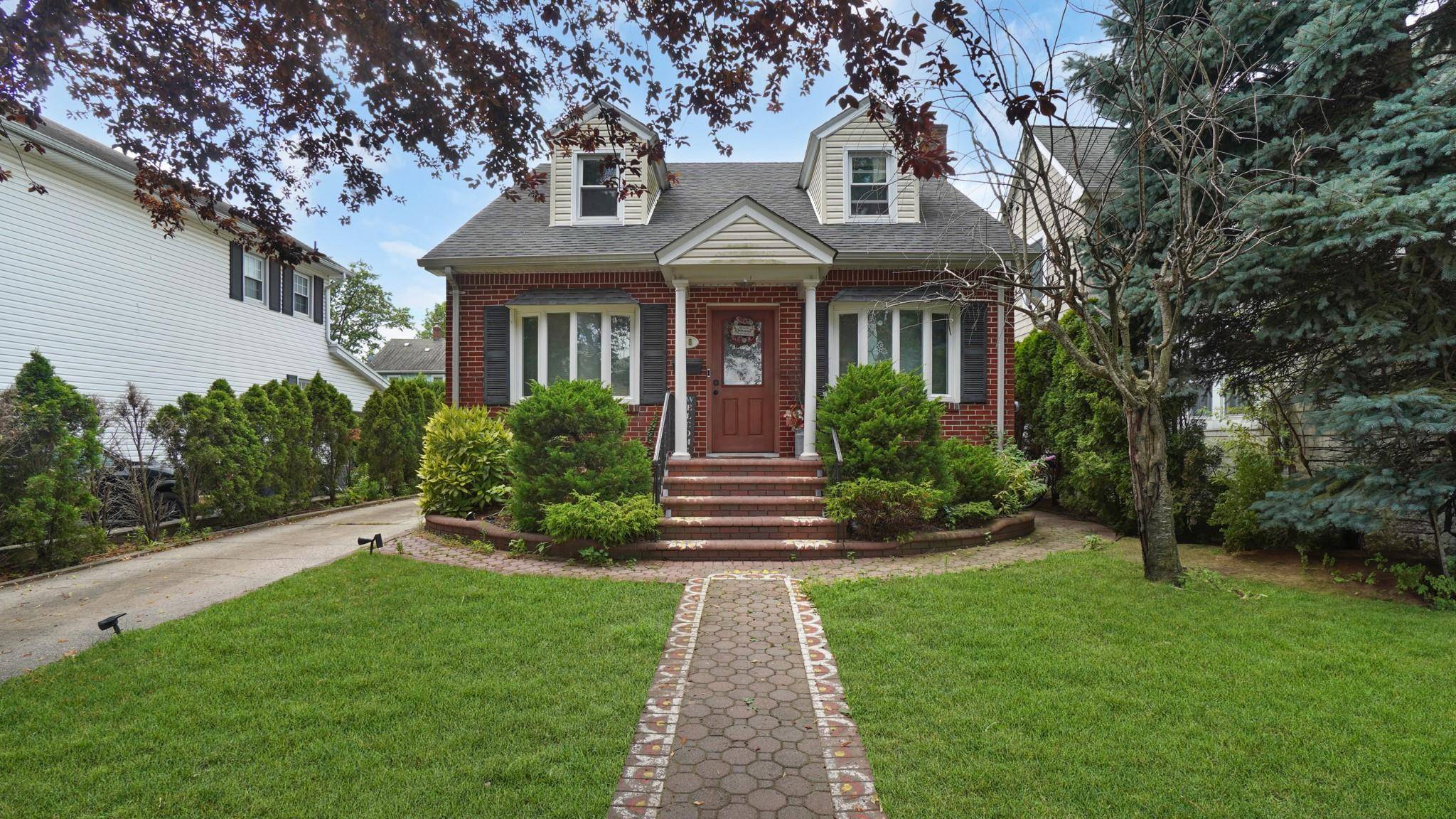 Welcome to 26 Deepan Ave in Floral Park a move in ready two family home with a fully finished basement and a spacious two car garage.