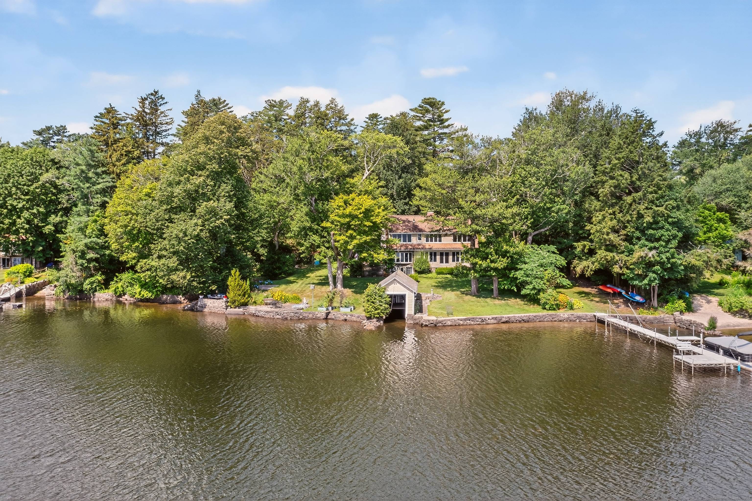 Set on one of Deer Island's largest waterfront parcels, this 1920s lake house offers approximately 3, 500 square feet of living space across five bedrooms and approximately 180 feet of ...