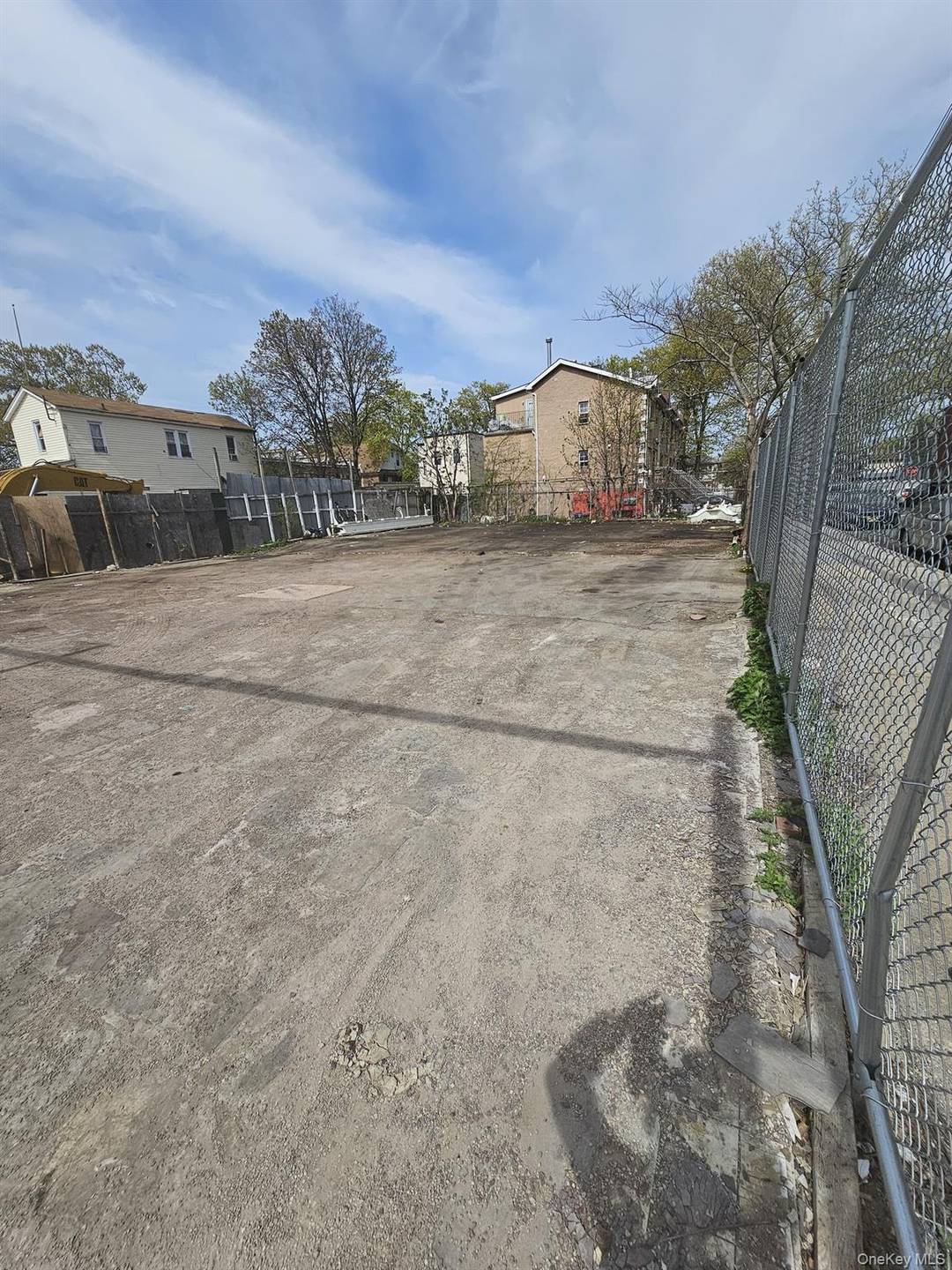 Vacant lot for sale with architectural survey and approved plans to build 3 two family mixed use buildings.