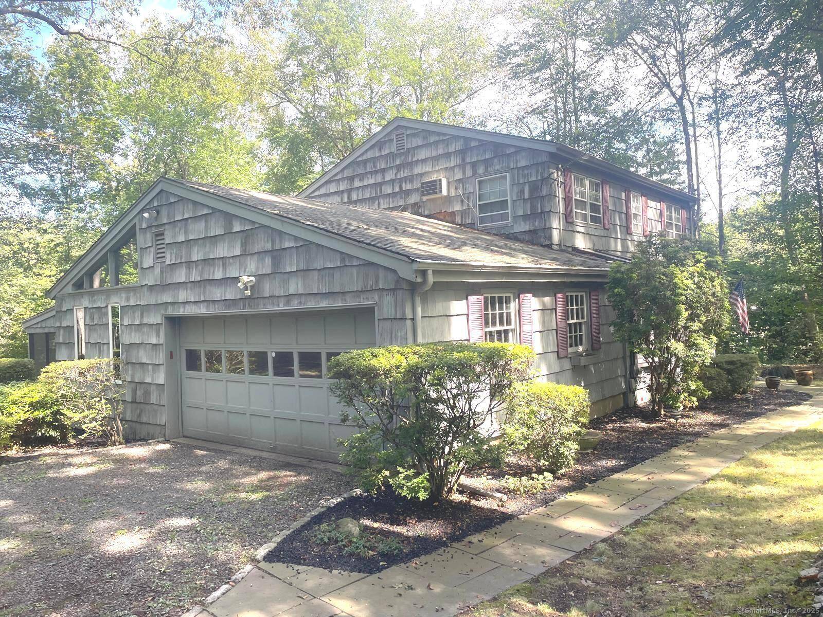Tucked away in highly sought after Norwalk Westport line location, this lovely Colonial sits on.