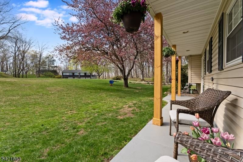 Situated at the end of a quiet cul de sac, this residence offers a private and serene setting on a beautiful wooded lot.