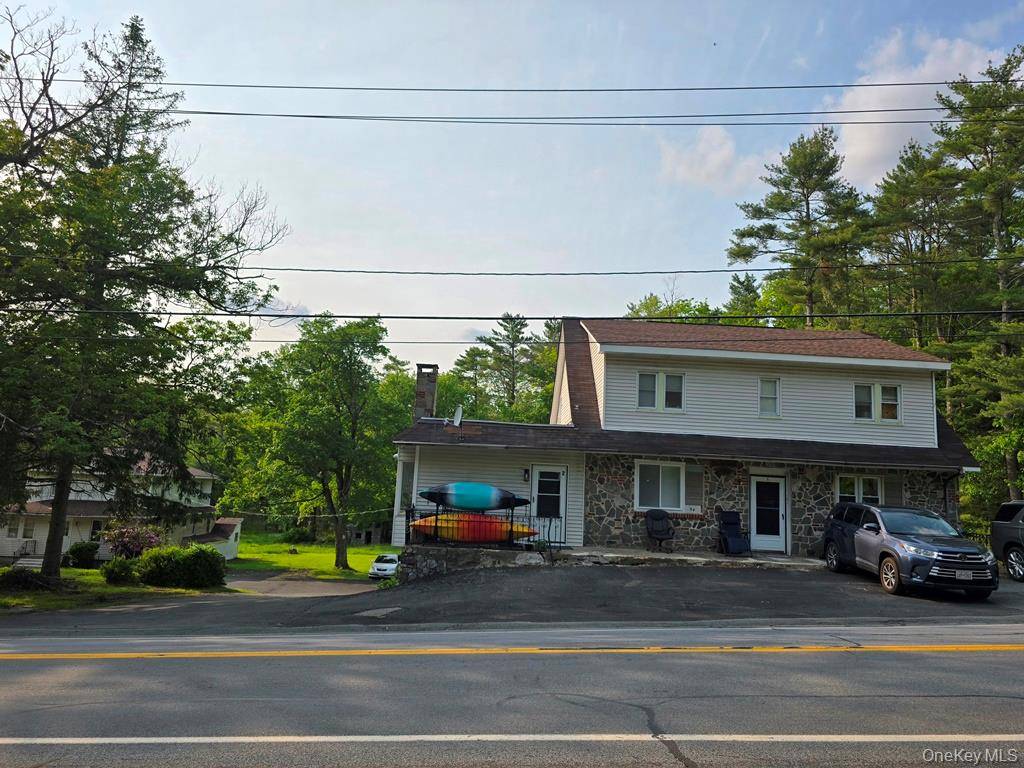 Turnkey Investment Opportunity 6 Unit Income Property on 6 Acres with Pond.