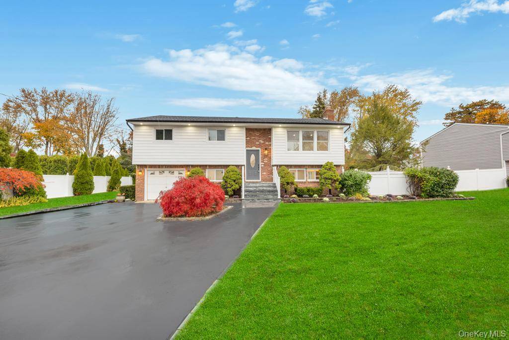 Beautifully renovated Hi Ranch in Dix Hills, located within the prestigious Half Hollow Hills School District.