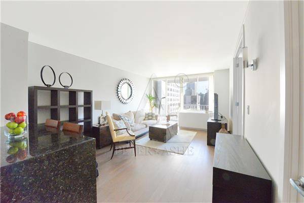 Indulge in luxury with this stunning one bedroom apartment boasting an open chef s open kitchen adorned with granite countertops and stainless steel appliances, perfect for hosting memorable gatherings.