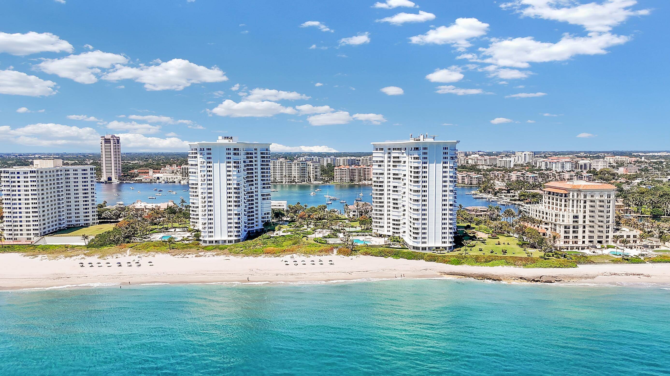 Experience the ultimate in coastal living with this elegant oceanfront residence, boasting panoramic ocean views from every room, along with picturesque scenes of the city skyline and Lake Boca.