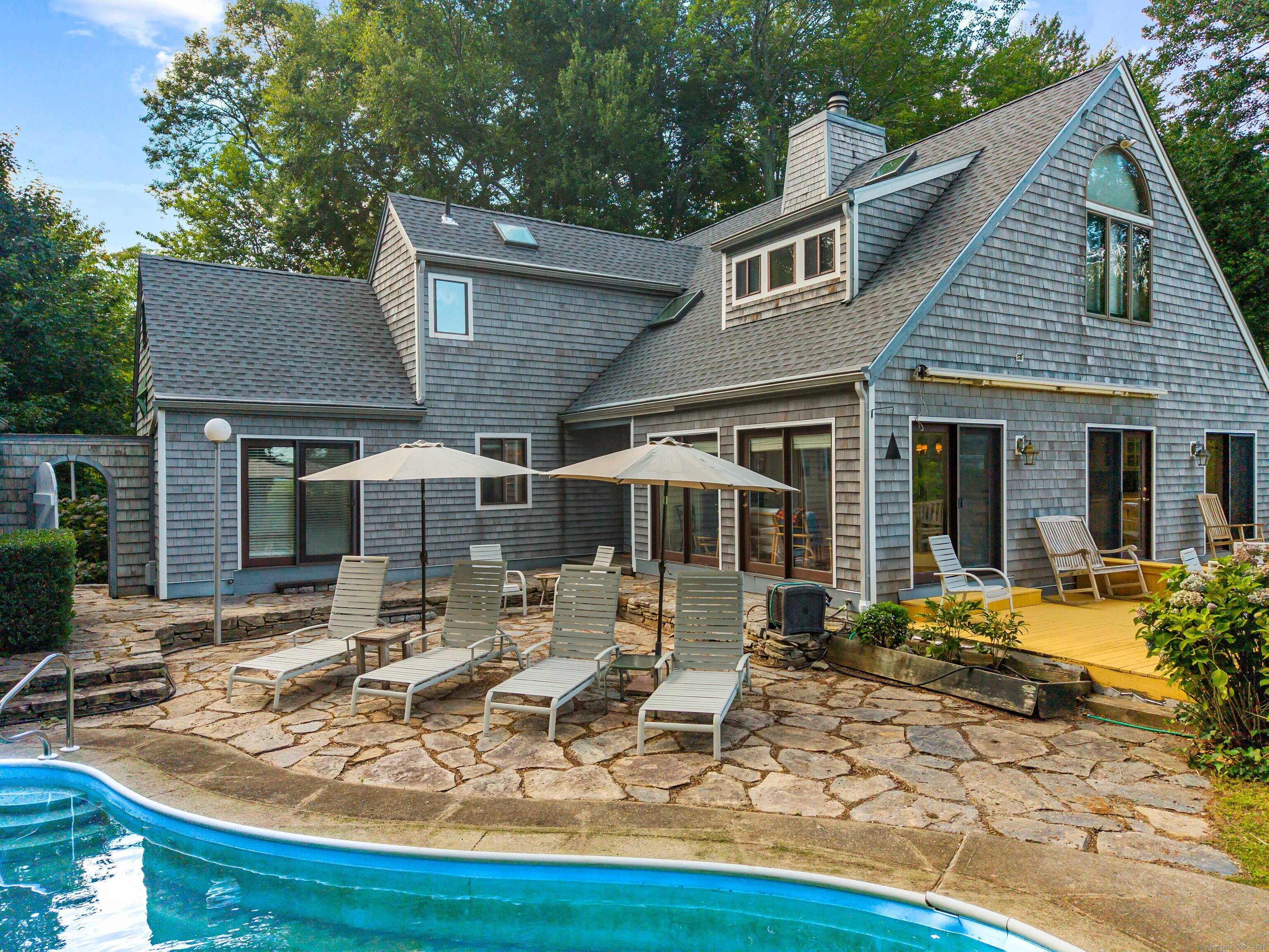 Discover the serenity of Ayers Point in this spacious 3400 sq ft home with captivating views of the Connecticut River and surrounding marshland.