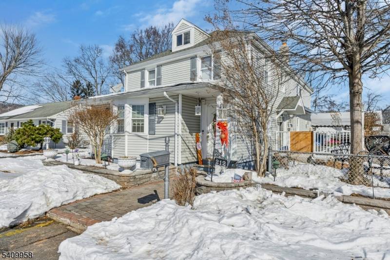 PRICE IMPROVEMENT ! Welcome to this spacious 9 room Colonial, beautifully set on an manicured lot.