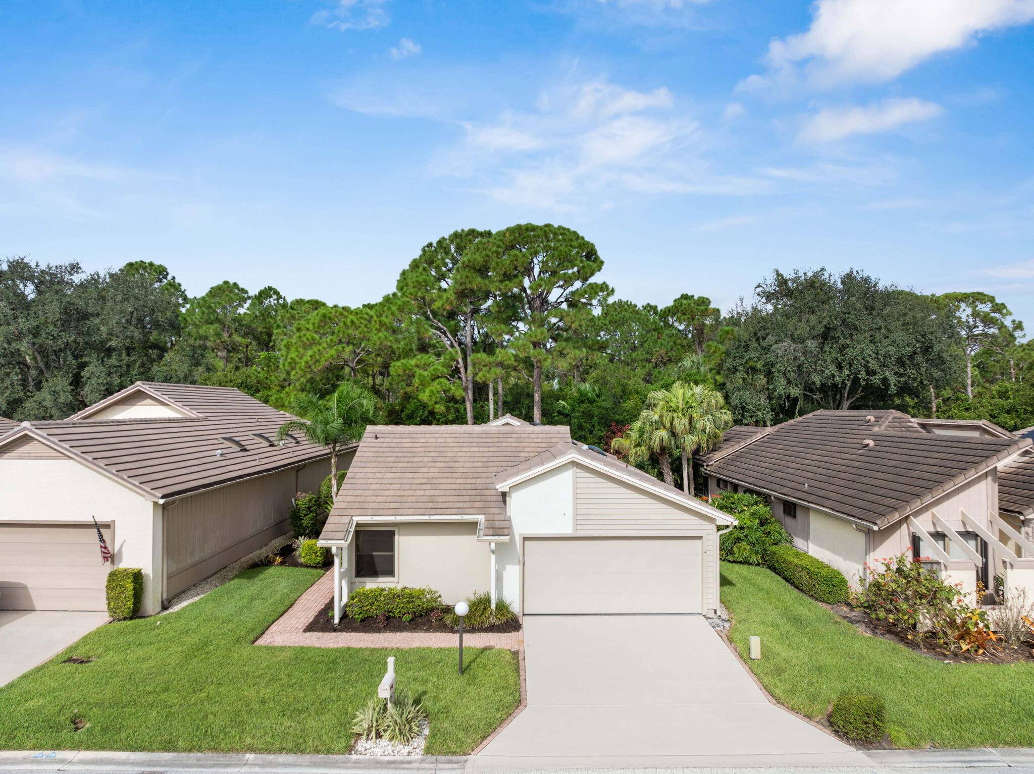 Completely remodeled residence in Mallard Creek, located within the gated Martin Downs Country Club.