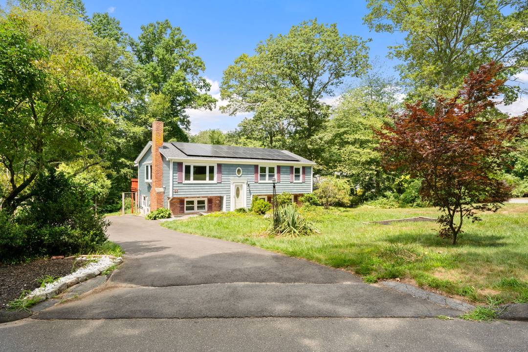 Welcome to 37 Stoneywood Dr, nestled in the heart of a lovely, tree lined neighborhood in Niantic, CT.