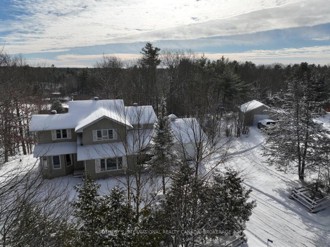 Tucked within a canopy of mature trees along a peaceful country road, just minutes from one of the region's most enchanting waterfront villages, this impeccably maintained residence offers the rare ...