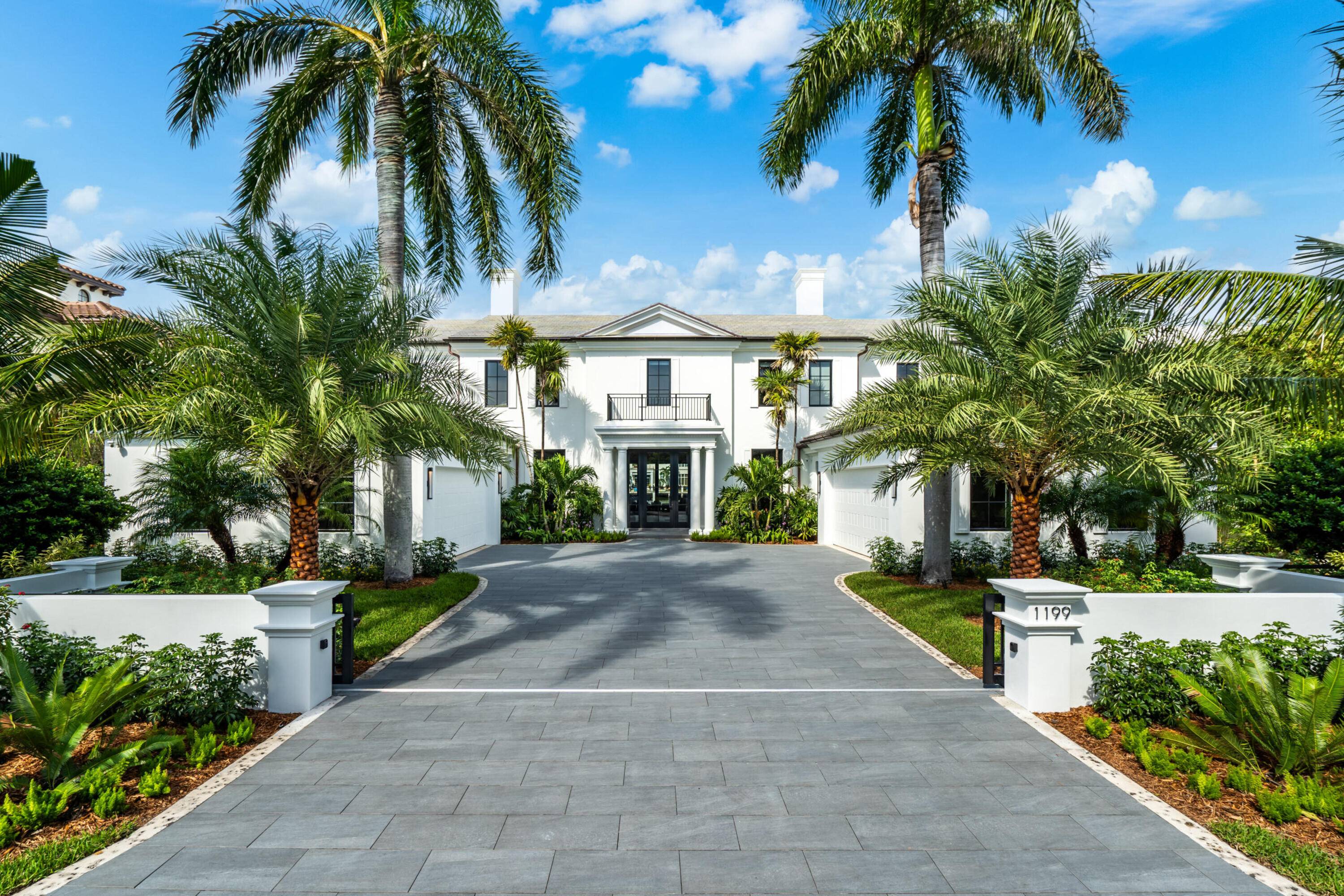 Reimagined gated Tropical Georgian inspired Intracoastal estate sited on 100 feet of waterfrontage in the prestigious Northside of The Estate Section.