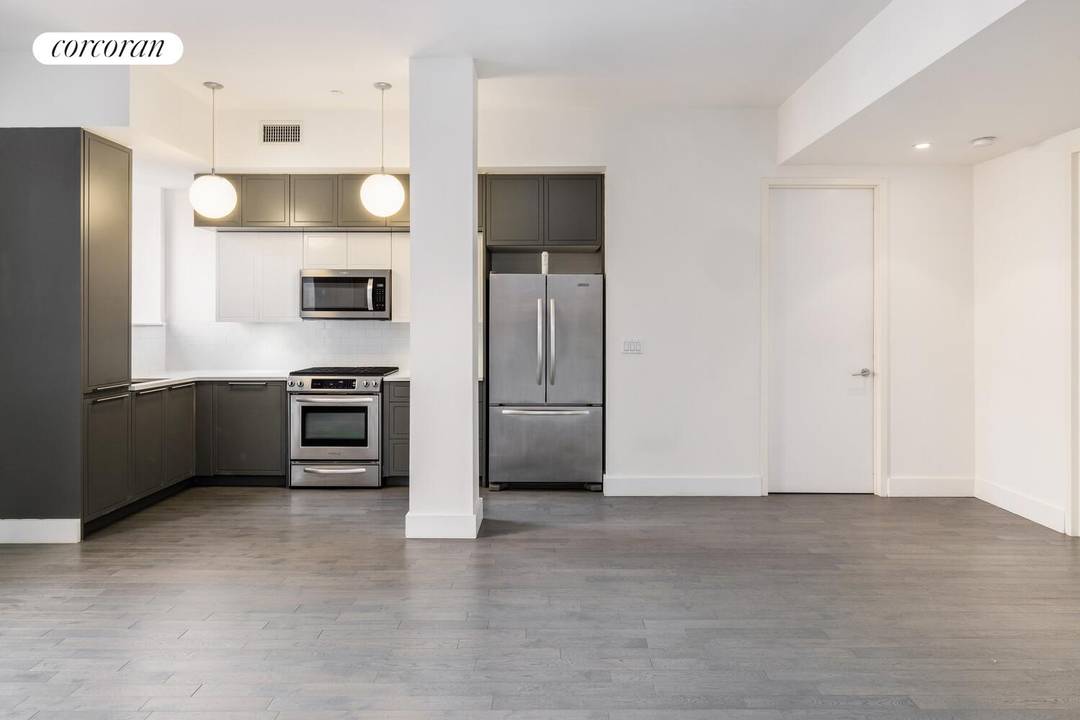 Convertible three bedroom condominium with over ten foot high ceilings and in unit washer and dryer.