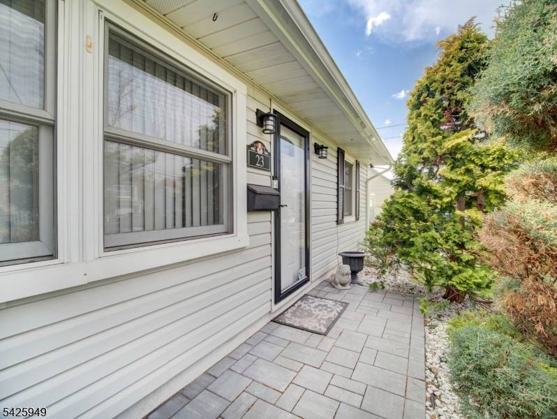 Welcome Home ! This 4 bedroom expanded cape is nestled right in the heart of Cedar Grove !