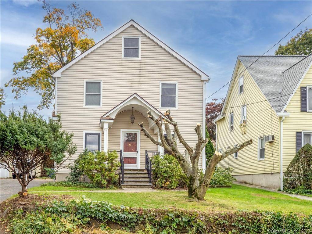 Step into this beautifully updated home featuring 9 foot ceilings on the first floor, new windows with privacy blinds and a modern kitchen with newer appliances and granite countertops.