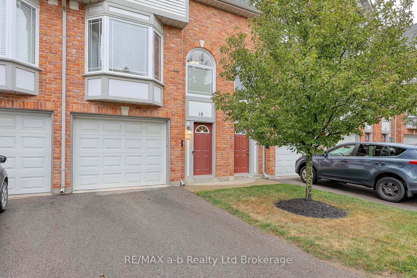 Stylish 3 bedroom townhome with a garage and green space !
