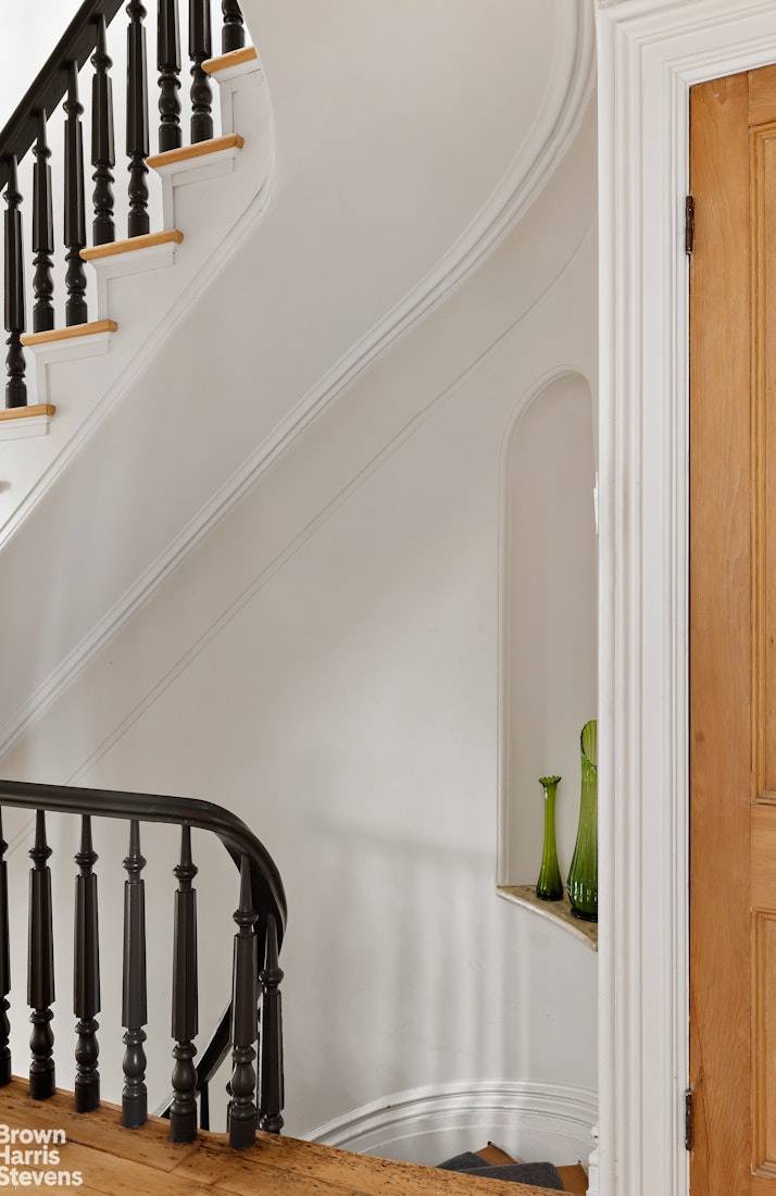 Stylishly Renovated Townhouse with Garage Tucked behind a beautifully restored facade on a quiet, tree lined block, 185 12th Street is a masterclass in thoughtful renovation and timeless design.