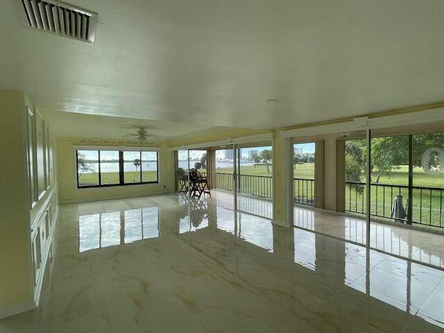 Rare waterfront 3 bedroom 3 bath condo situated on the south end of the coveted gated community of Twelve Oaks.