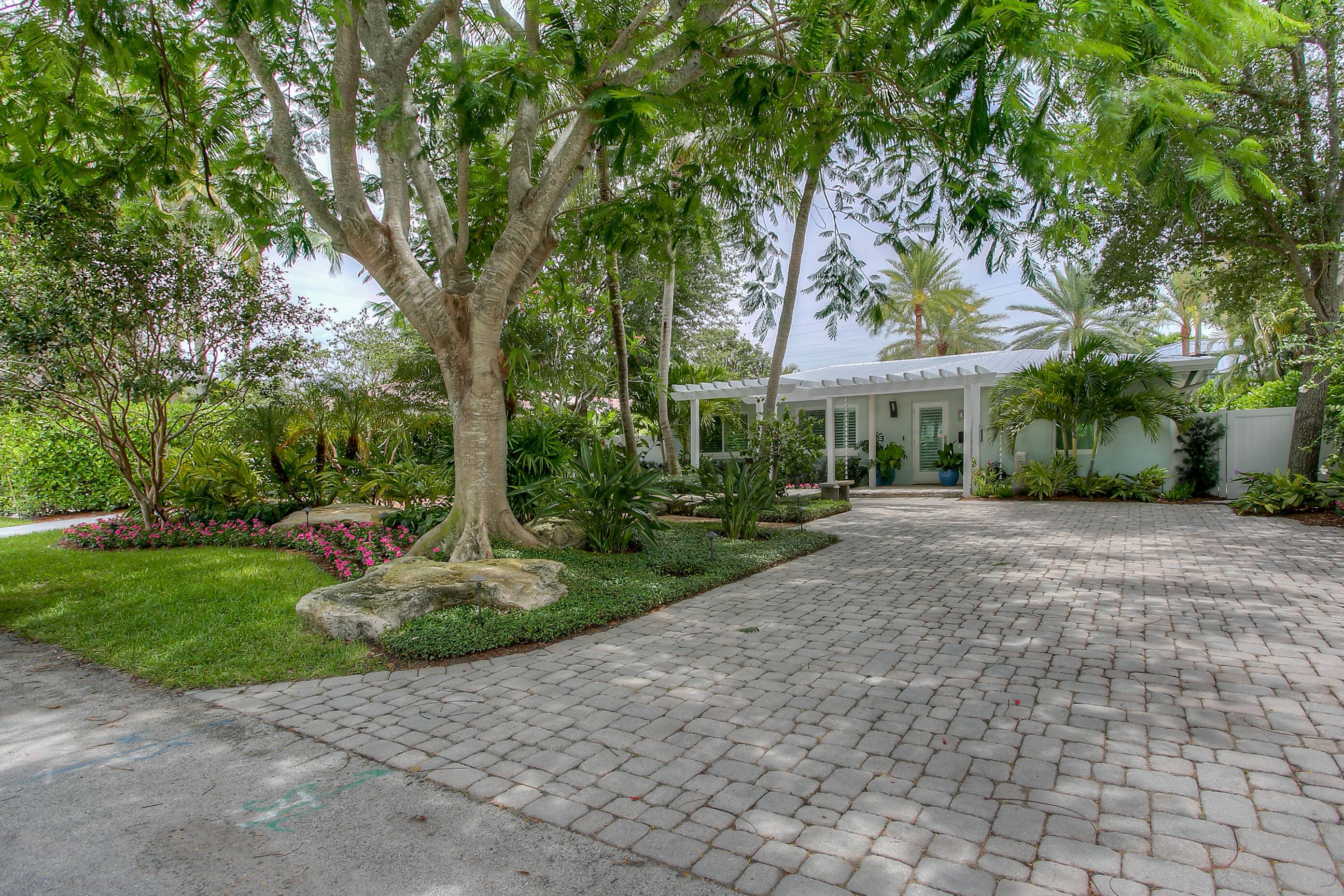 Stunning Renovated 4 bedroom, 5 bath single family Lake Ida Home with Resort Style Backyard blends modern luxury with timeless comfort.