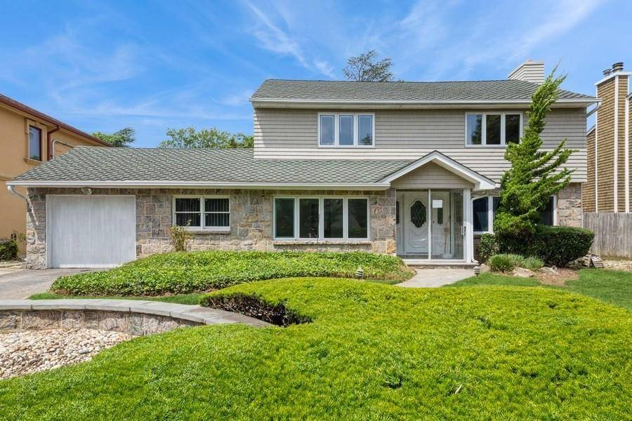 Charming Center Hall Colonial located on a highly desirable street !