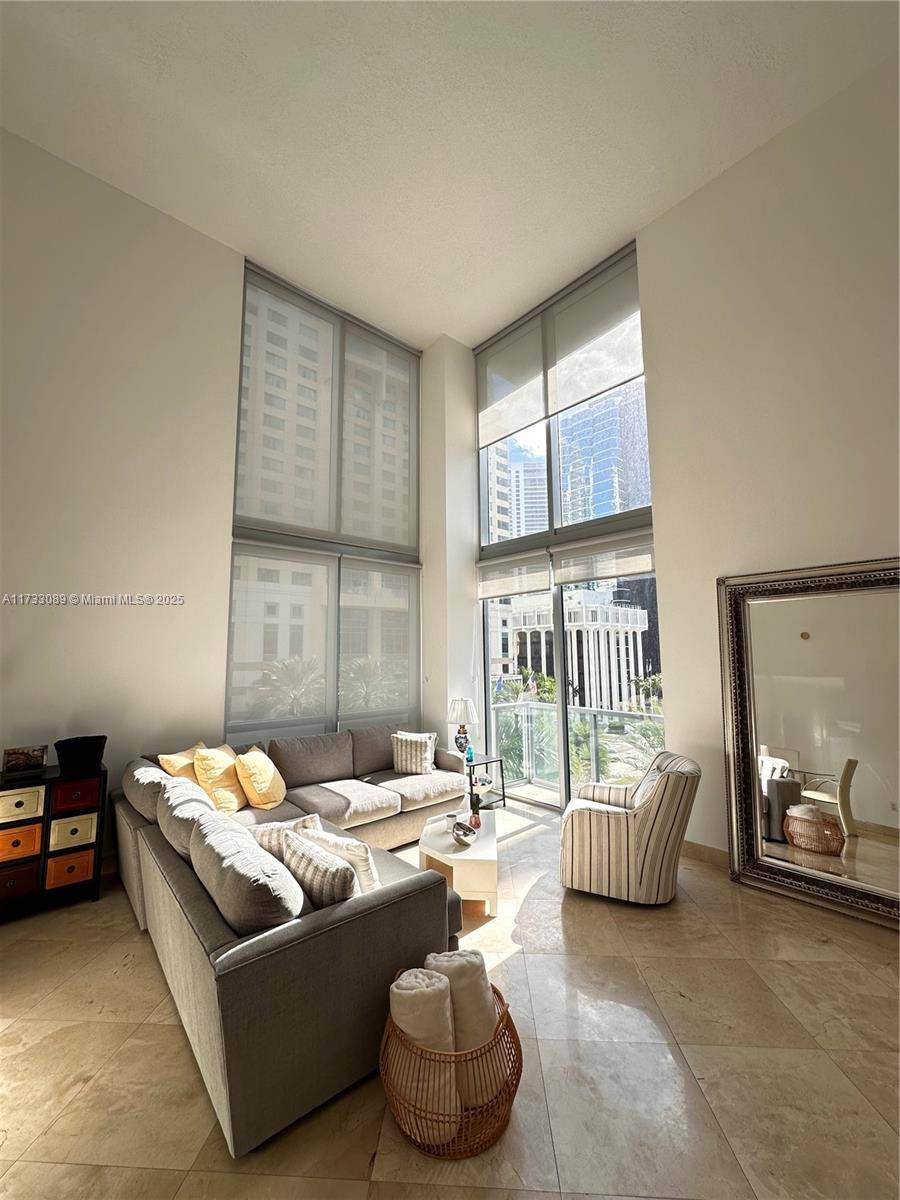 Spectacular two story loft, with the Skyline city view in the hearth of Brickell, the financial district of Miami, the floor is marble, included 2 assigned parking spaces.